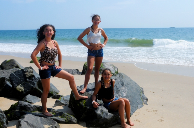 three girls on rocks